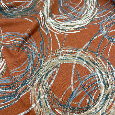 Viscose jersey med mønster på en brun baggrund